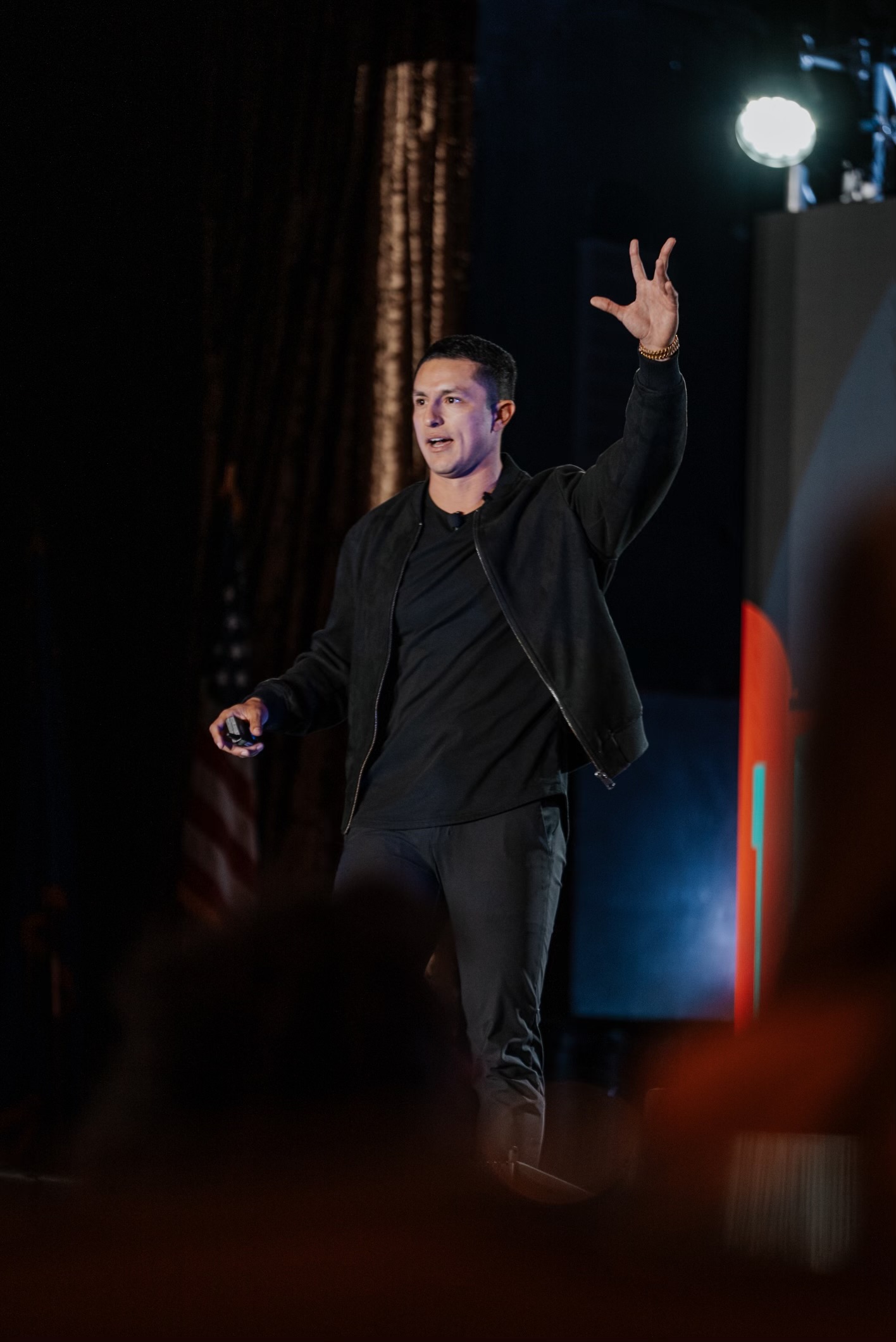 Javi Chavez speaking on stage